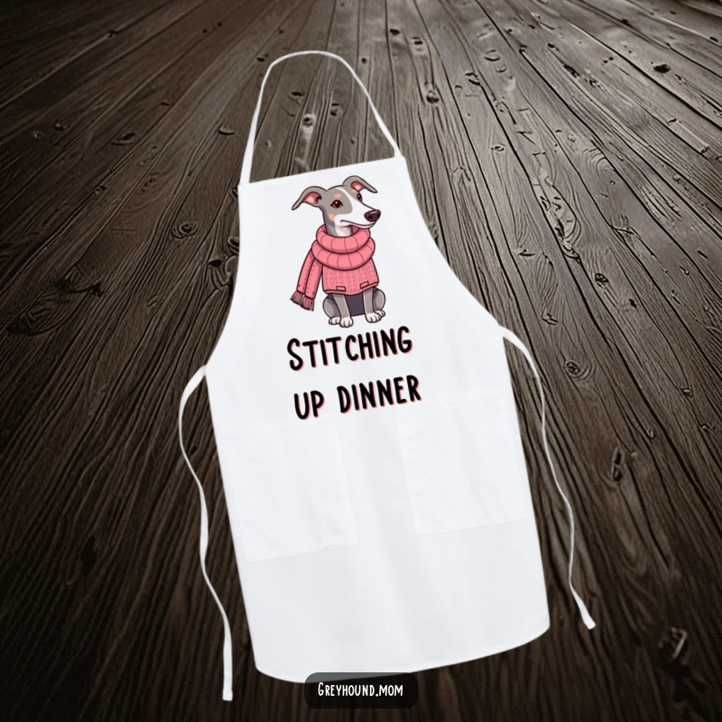 Funny Greyhound apron, depicting the dog in a sweater, knitting a scarf, adding a whimsical touch to kitchen wear. A delightful funny gift for crafters.
