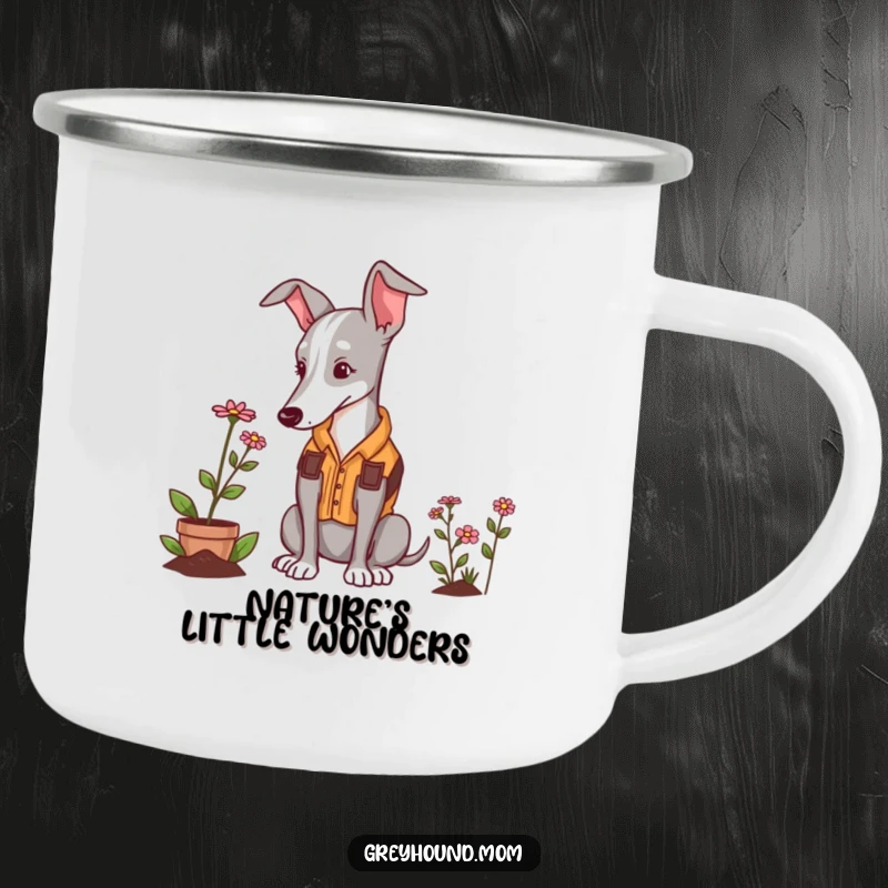 Funny Greyhound gardener camping mug, a dog in a vest admiring a flower, outdoors.