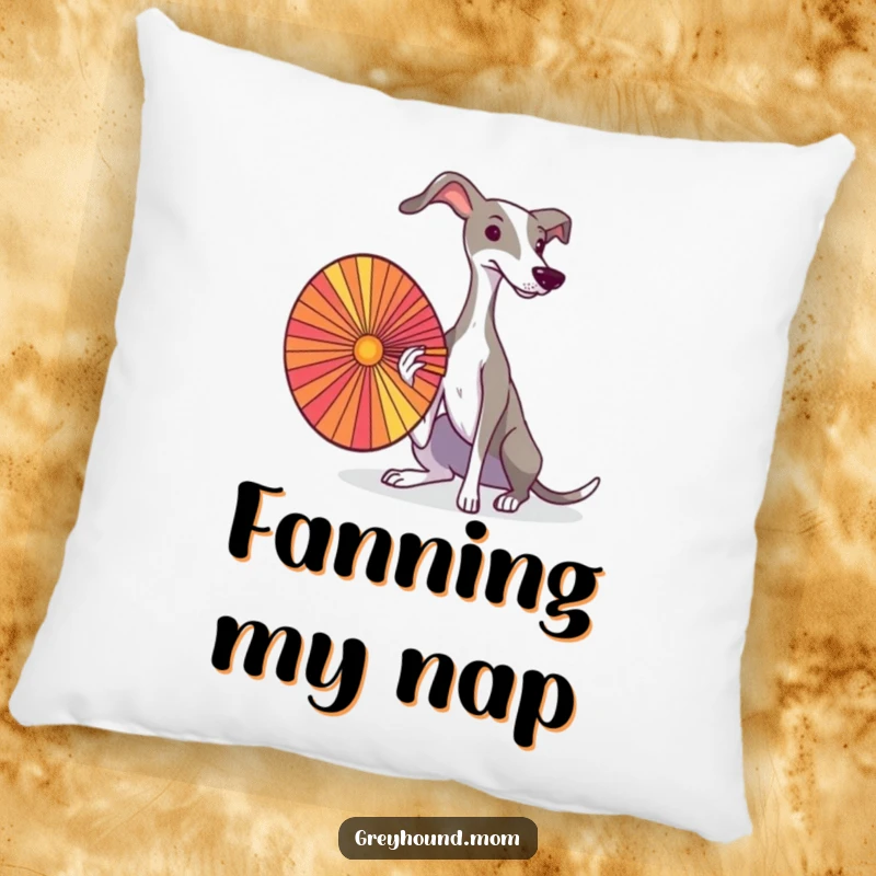 A Greyhound elegantly fanning itself with a colorful fan, depicted on a soft decorative pillow.