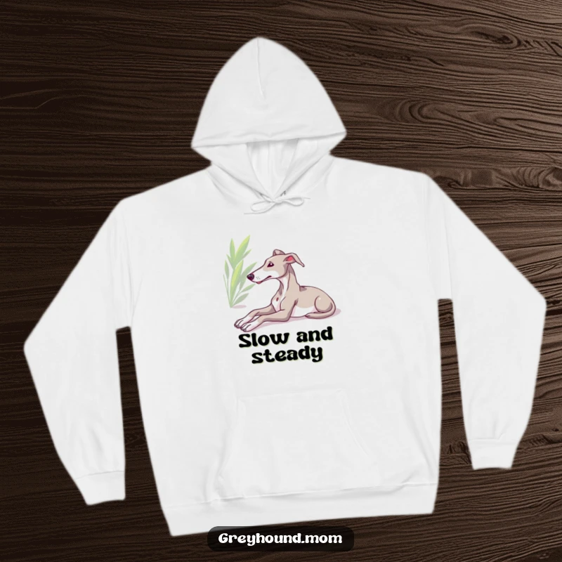Funny Greyhound hoodie, relaxed dog stretching in sunlight, comfortable and stylish design, ideal humorous gift for hound lovers.