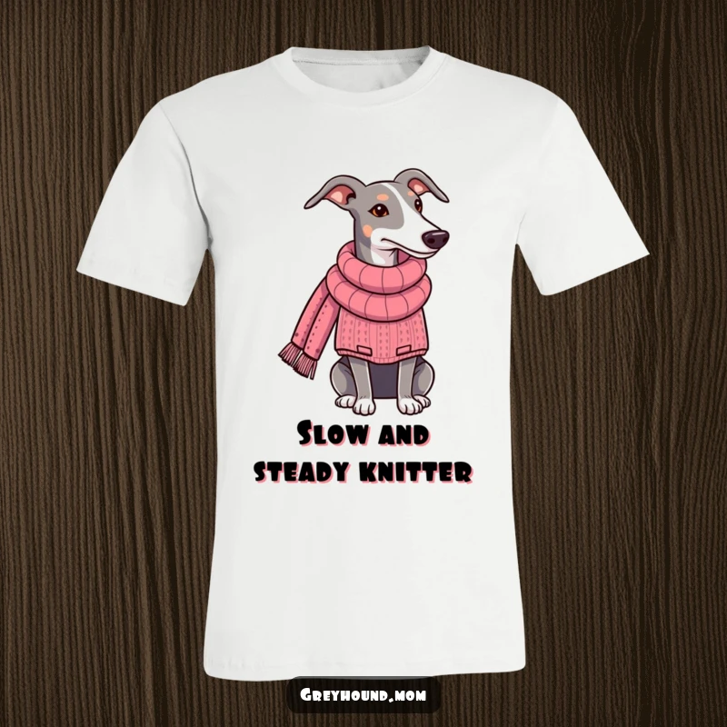 Funny Greyhound t-shirt, the dog is wearing a comfy sweater and knitting a lengthy scarf. Ideal funny gift for crafters and dog parents.