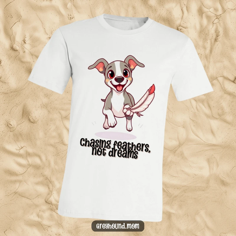 Funny t-shirt featuring a Greyhound with wide, eager eyes intently chasing a feather toy with delight.