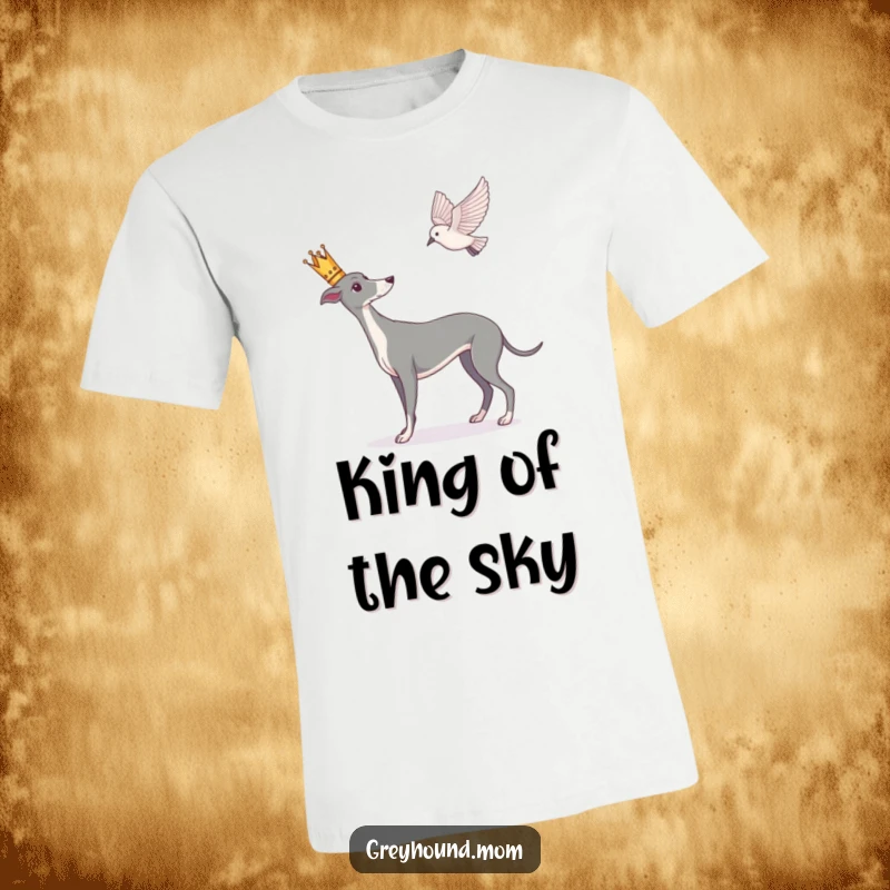 Funny Greyhound t-shirt, dog with a small crown observing a bird in flight, majestic and attentive.